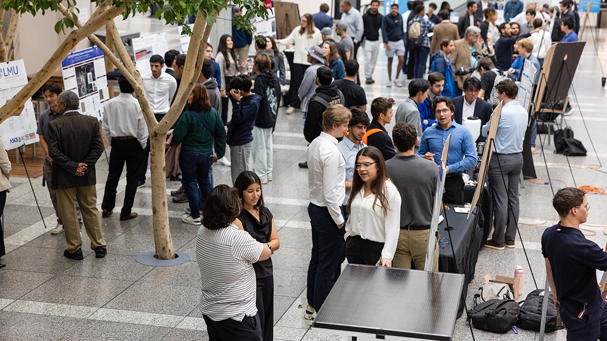 Crowd of people viewing posters